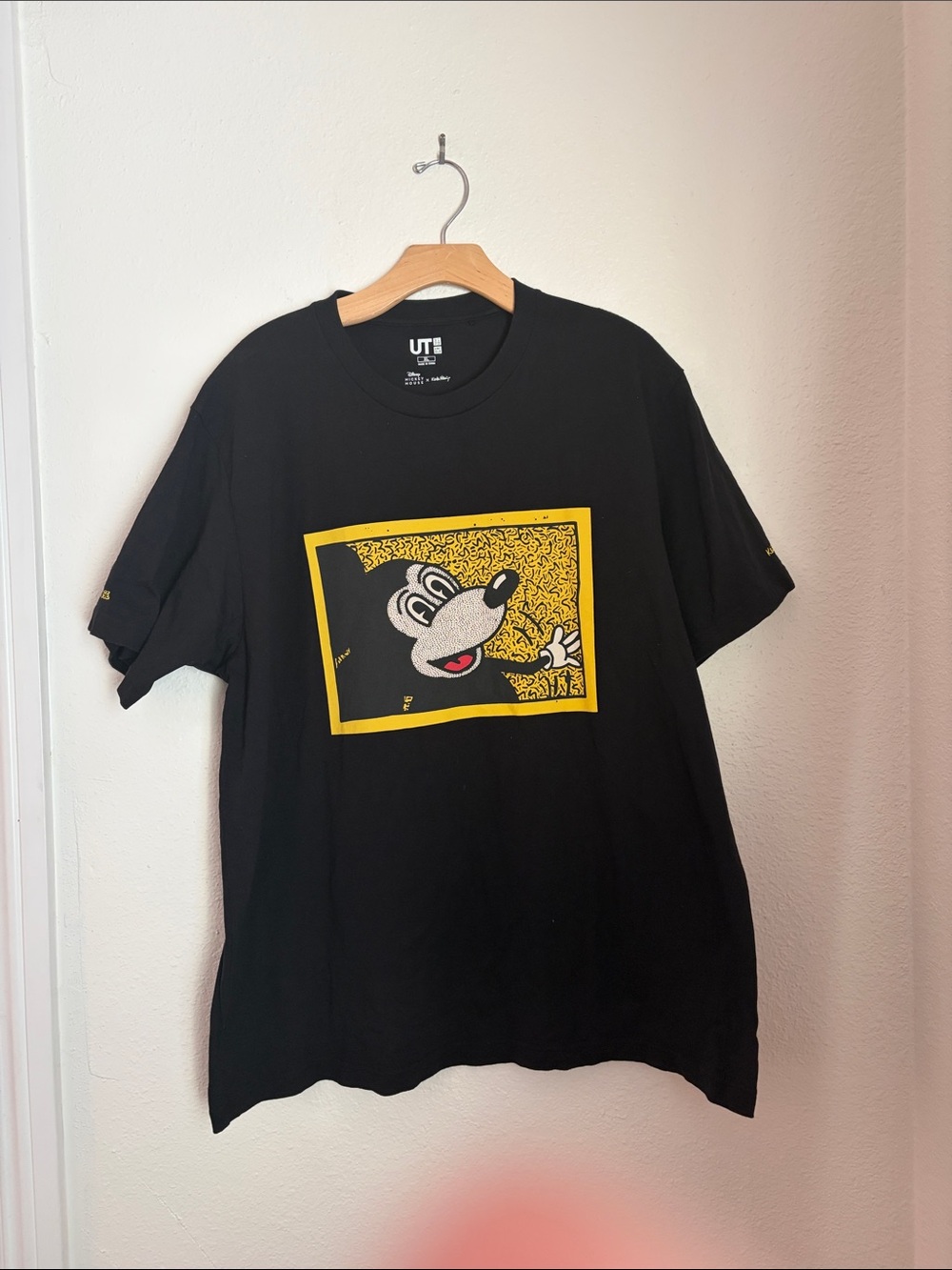 Uniqlo Black Short Sleeve Tee with Yellow Framed Cartoon Graphic